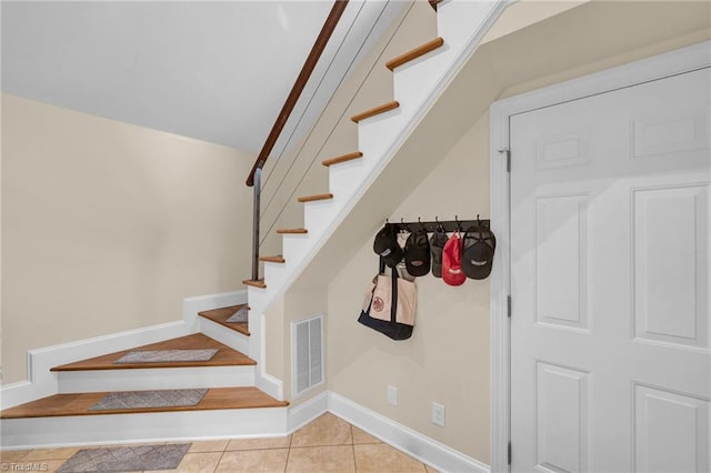 stairs with tile patterned flooring