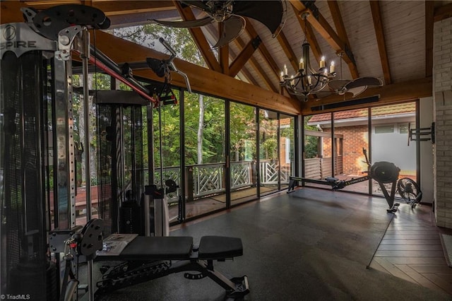 workout area with a notable chandelier and high vaulted ceiling