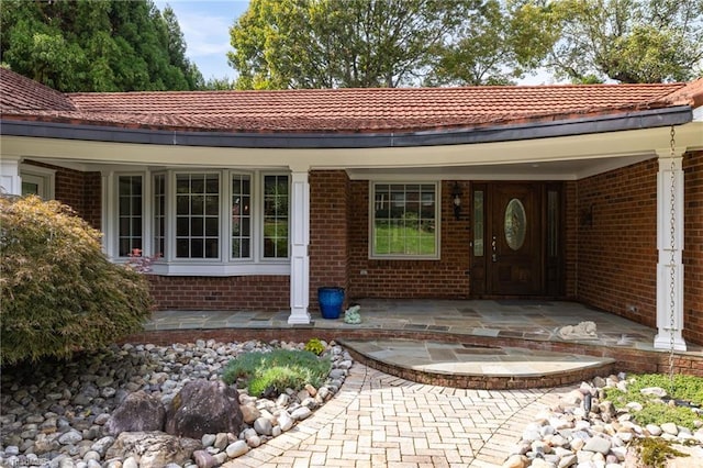 doorway to property with covered porch