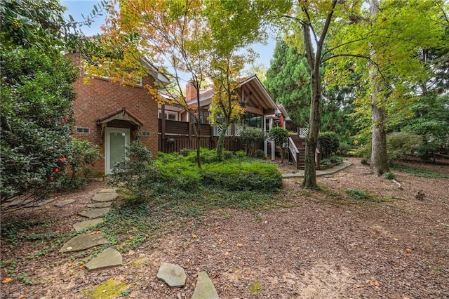 view of yard with a wooden deck