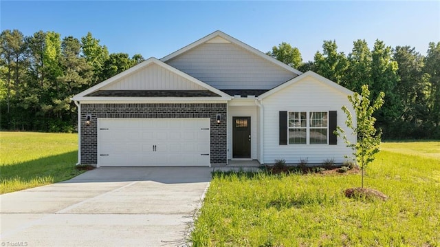 view of front facade featuring an attached garage, a front lawn, concrete driveway, and brick siding