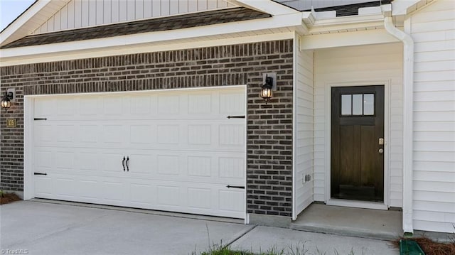 garage with concrete driveway