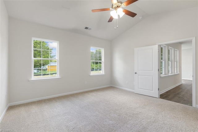 carpeted spare room with lofted ceiling and ceiling fan