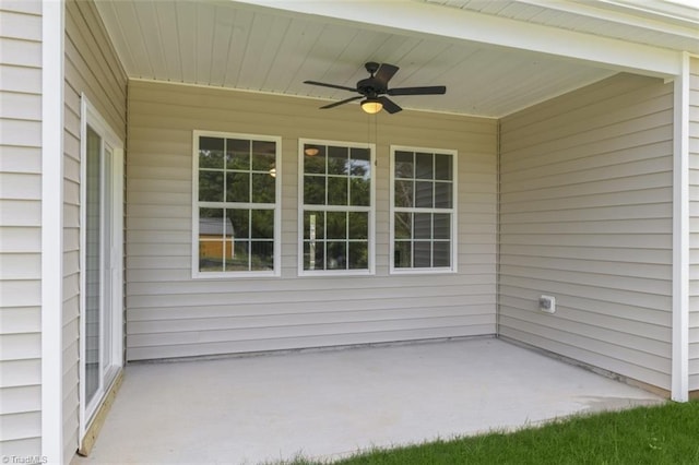 view of patio featuring ceiling fan