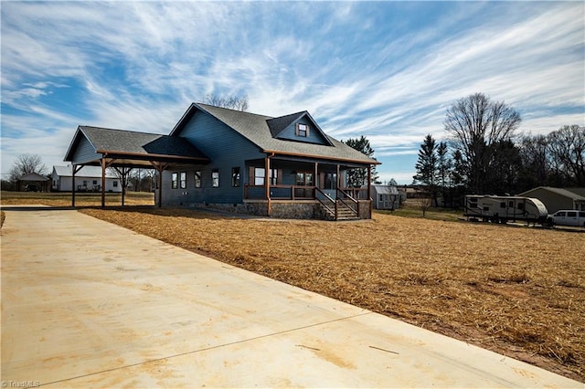 country-style home with covered porch and a front yard