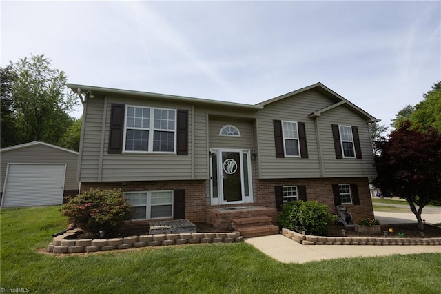 113 Stone Bridge Rd, Mount Airy, NC 27030 - raised ranch with a front yard, a detached garage, brick siding, and an outbuilding