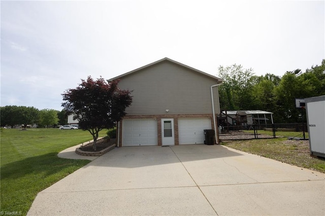 113 Stone Bridge Rd, Mount Airy, NC 27030 - view of home's exterior with an attached garage, a yard, driveway, and brick siding