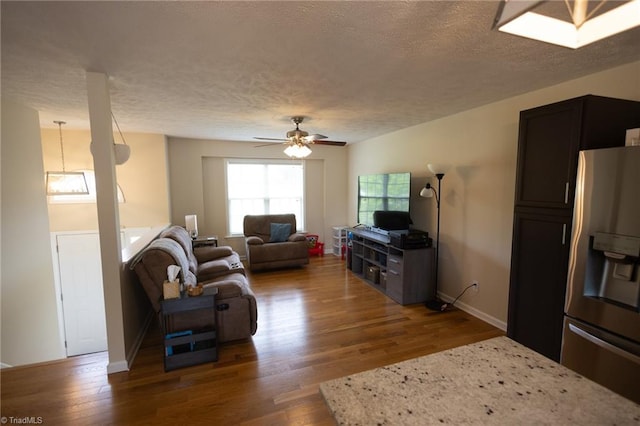 113 Stone Bridge Rd, Mount Airy, NC 27030 - living room featuring a textured ceiling, wood finished floors, a ceiling fan, and baseboards
