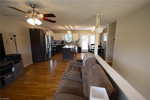 113 Stone Bridge Rd, Mount Airy, NC 27030 - living area featuring ceiling fan, wood finished floors, and baseboards