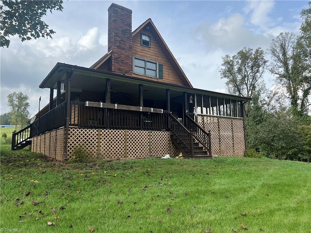 rear view of property with a yard