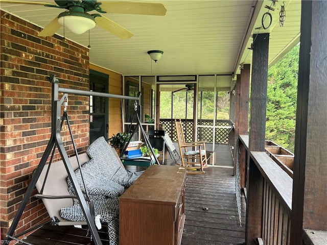 sunroom / solarium with ceiling fan