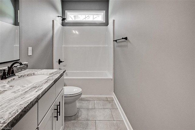 bathroom with vanity, baseboards, tile patterned floors, bathing tub / shower combination, and toilet