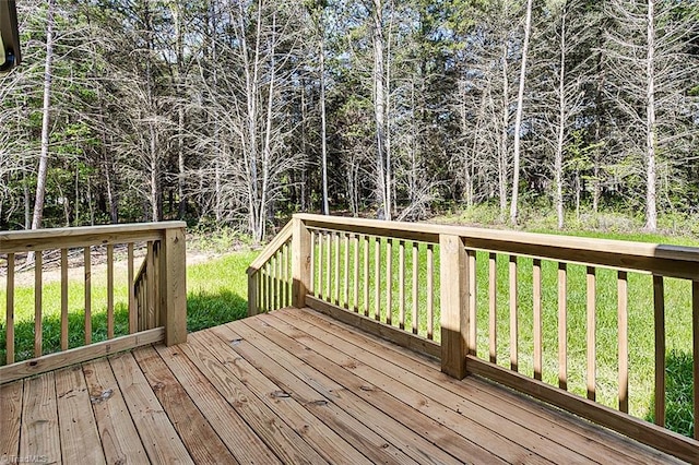 wooden deck with a yard