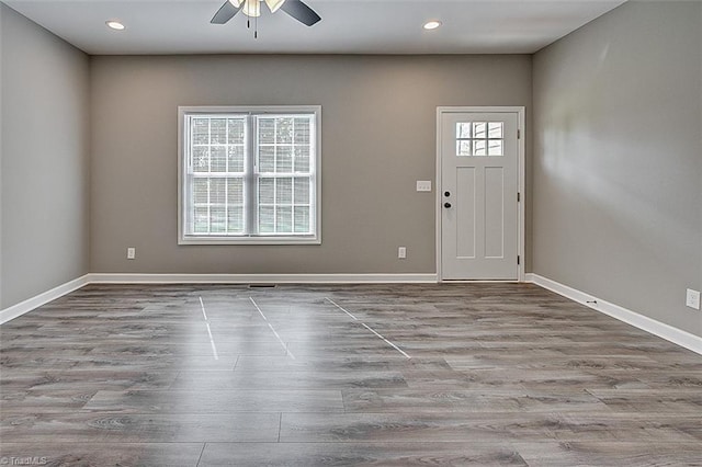entryway with wood finished floors, ceiling fan, baseboards, and recessed lighting