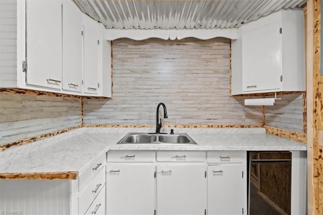 539 W Salisbury St, Denton, NC 27239 - kitchen featuring light countertops, white cabinets, and backsplash