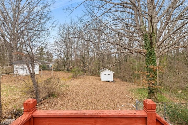 view of yard featuring a shed and an outdoor structure