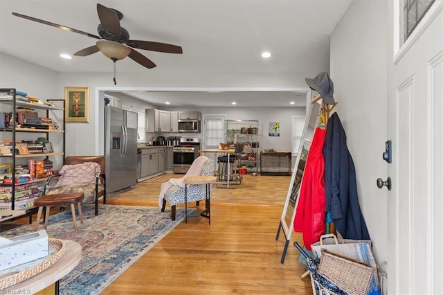 interior space with recessed lighting, a ceiling fan, and light wood finished floors