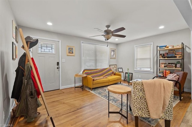 living room with light wood-style flooring, recessed lighting, baseboards, and ceiling fan