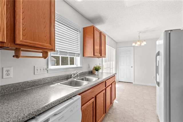 189 Lochshire Ln, Woodleaf, NC 27054 - kitchen with stainless steel fridge with ice dispenser, a chandelier, white dishwasher, a textured ceiling, and brown cabinets