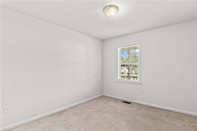 189 Lochshire Ln, Woodleaf, NC 27054 - carpeted spare room featuring baseboards and a textured ceiling