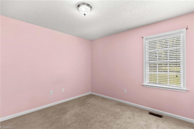 189 Lochshire Ln, Woodleaf, NC 27054 - carpeted empty room with baseboards and a textured ceiling