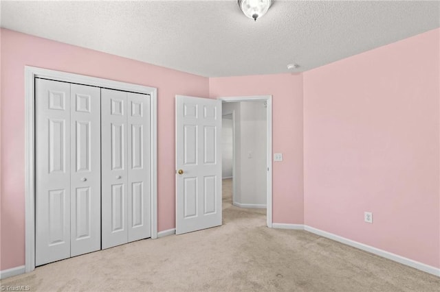 189 Lochshire Ln, Woodleaf, NC 27054 - unfurnished bedroom with carpet flooring, a textured ceiling, and a closet