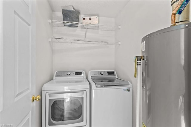 189 Lochshire Ln, Woodleaf, NC 27054 - laundry room with electric water heater and washing machine and clothes dryer