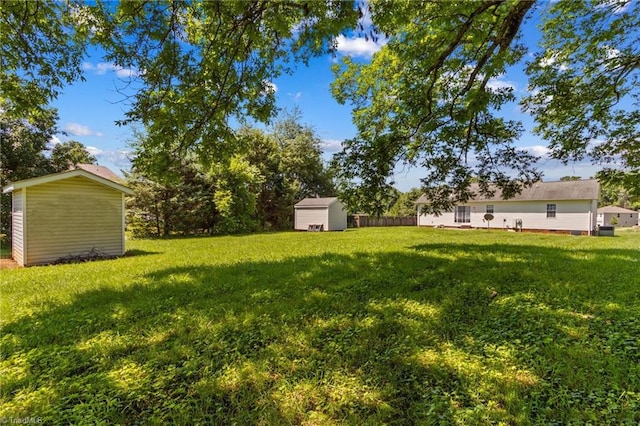 189 Lochshire Ln, Woodleaf, NC 27054 - view of green lawn featuring a storage shed