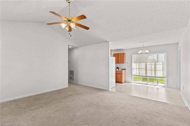 189 Lochshire Ln, Woodleaf, NC 27054 - unfurnished living room with light carpet, a chandelier, ceiling fan, and vaulted ceiling