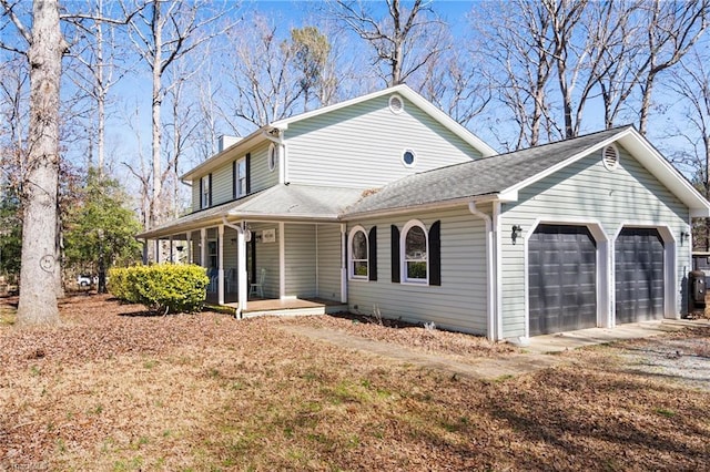 view of property exterior with a garage and a porch