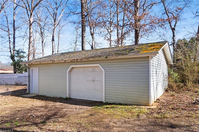 detached garage with fence