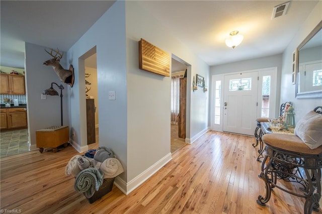 entryway with light hardwood / wood-style flooring