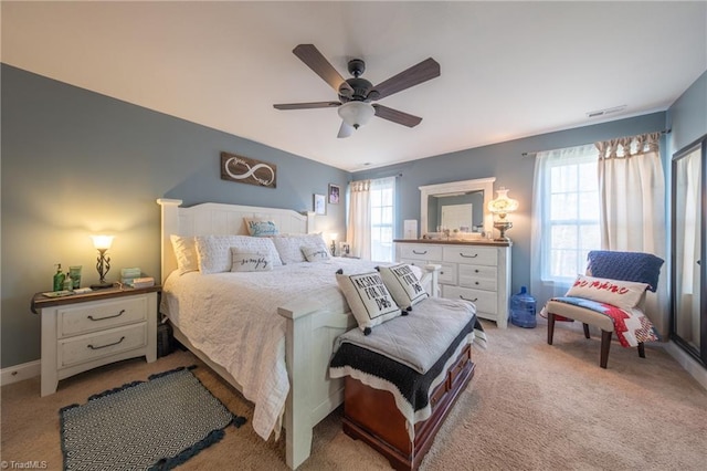 bedroom featuring ceiling fan and light colored carpet