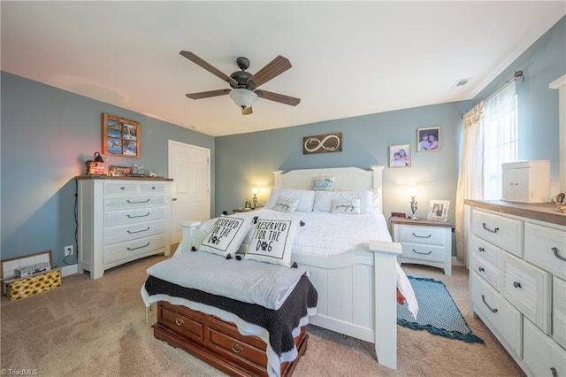 bedroom featuring light colored carpet and ceiling fan