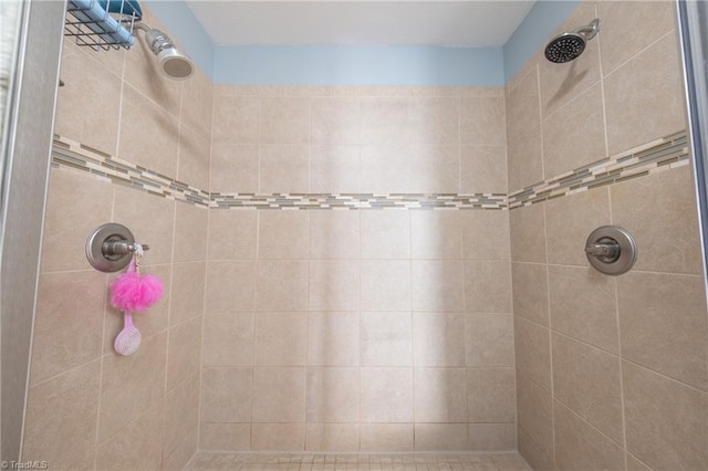 bathroom with tiled shower