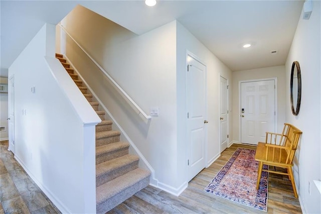 foyer entrance with hardwood / wood-style flooring