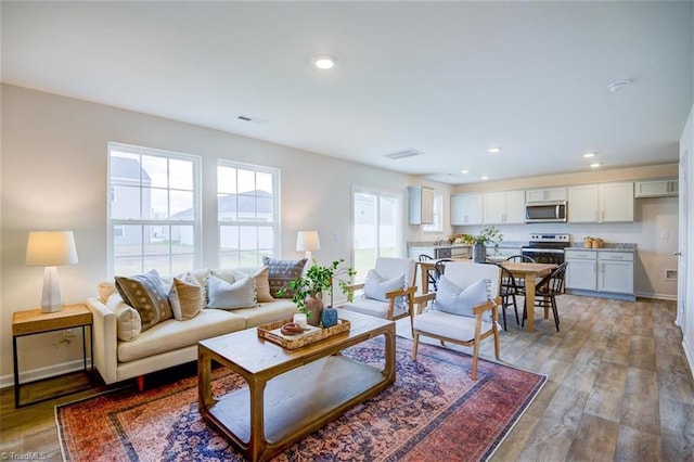 living room with light hardwood / wood-style floors