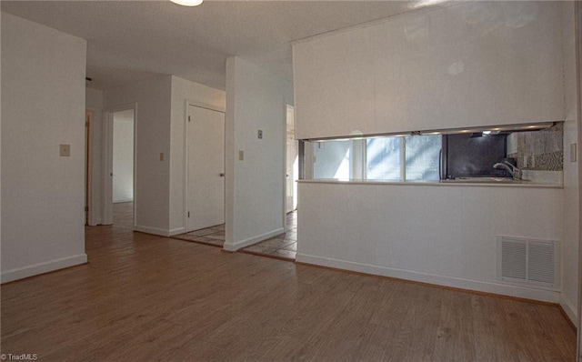 spare room featuring light hardwood / wood-style flooring