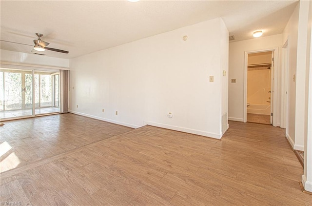 unfurnished room featuring ceiling fan and light hardwood / wood-style floors