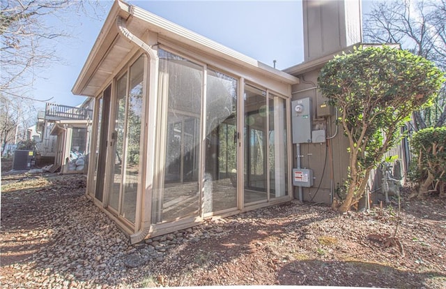 view of side of property with a sunroom