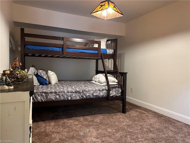 carpeted bedroom with baseboards
