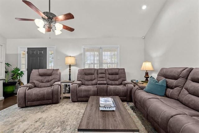 living room with lofted ceiling, a ceiling fan, and wood finished floors