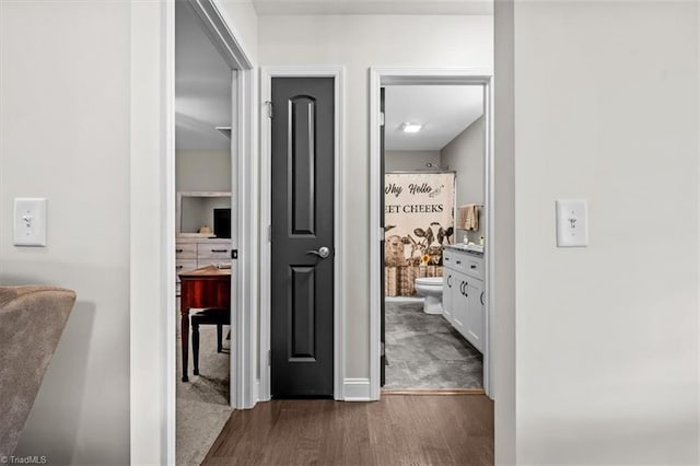 hall with dark wood-type flooring