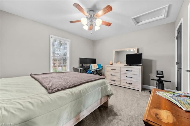 bedroom featuring attic access, light carpet, ceiling fan, and baseboards