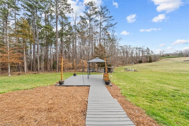 surrounding community with a gazebo and a yard