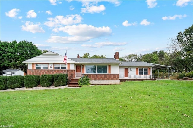 ranch-style house with a front yard, a chimney, and brick siding