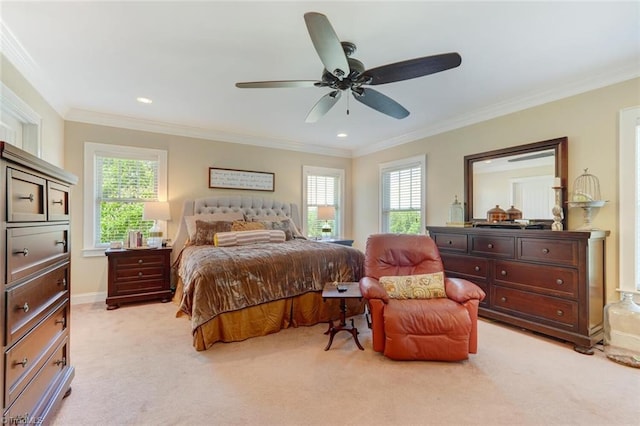 carpeted bedroom featuring multiple windows, ornamental molding, and ceiling fan