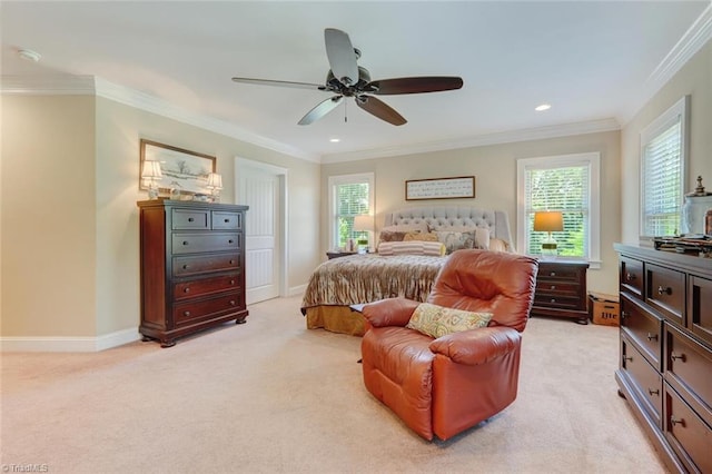 bedroom with crown molding, light colored carpet, and ceiling fan