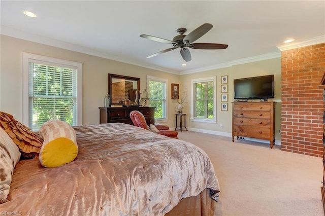 carpeted bedroom featuring crown molding and ceiling fan