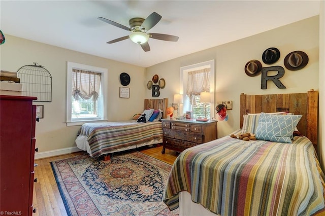 bedroom featuring hardwood / wood-style flooring and ceiling fan